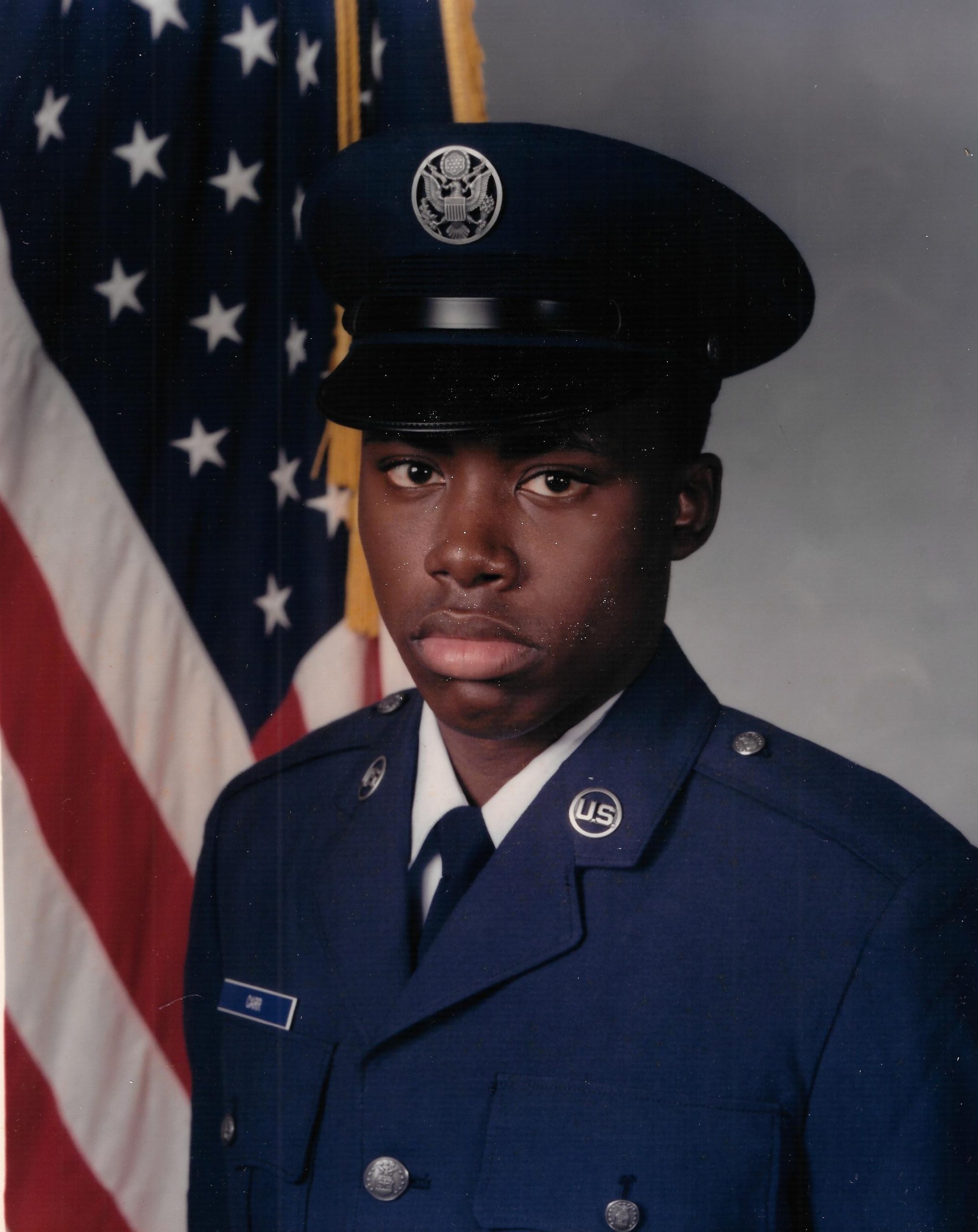 James L. Carr Jr. in Air Force basic training uniform, standing at attention